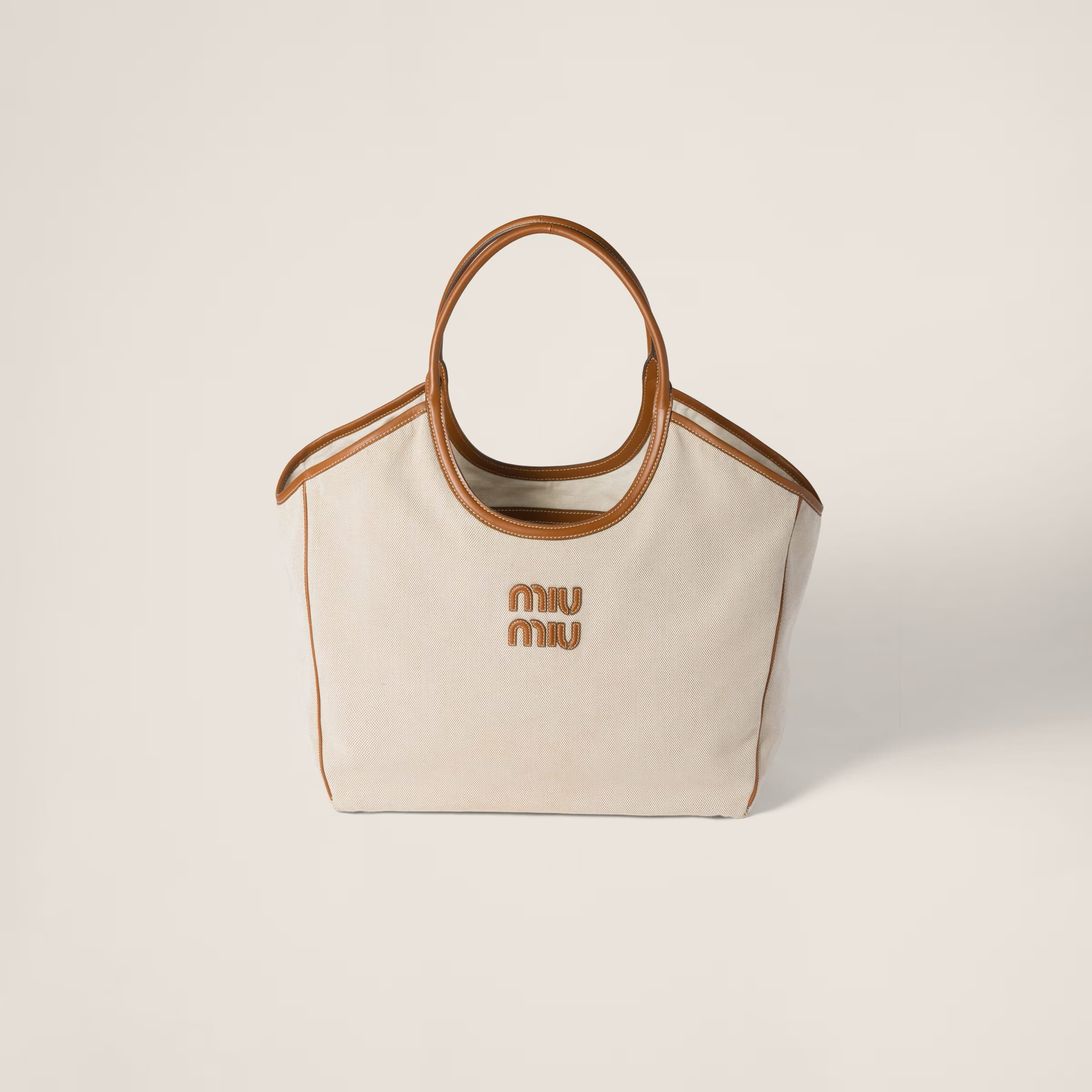 IVY canvas and leather bag - Large, SGD 3550 (approximately P156,583.54), MIU MIU, miumiu.com